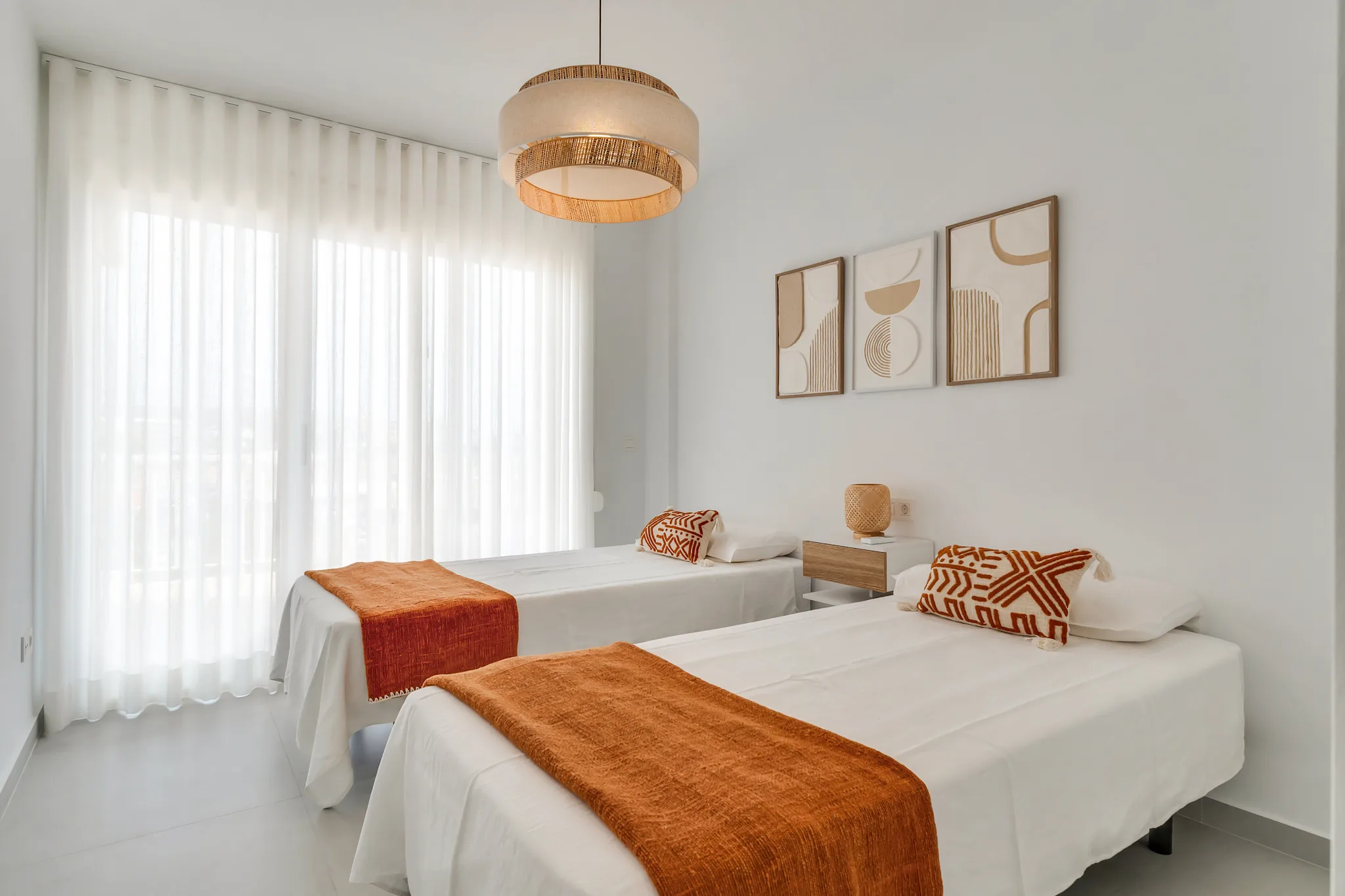 La Brisa twin bedroom with terracotta accents