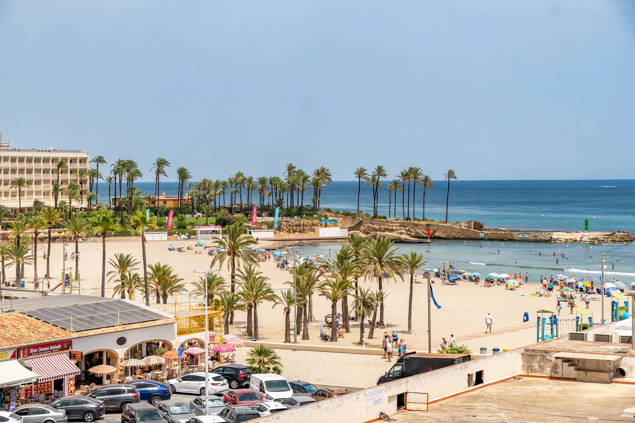 Jávea Arenal beach — palm trees and Mediterranean sea